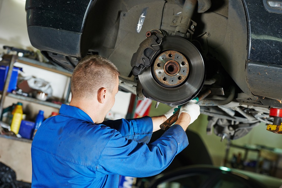 Mechanic repairing brake rotors