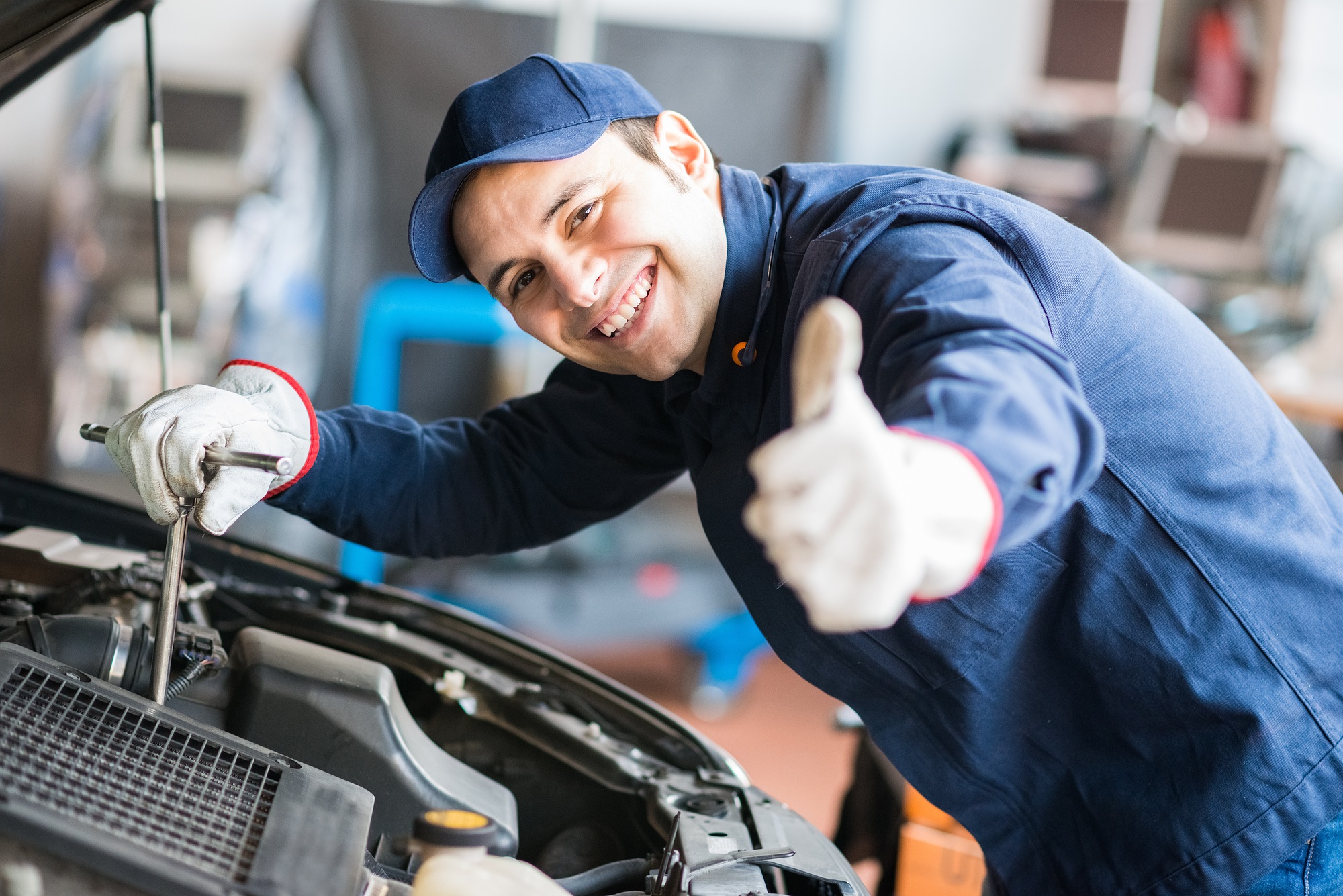 Friendly Auto technician fix car and truck air conditioning